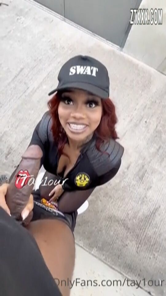 Coop Princess Tay checking out a black man’s car